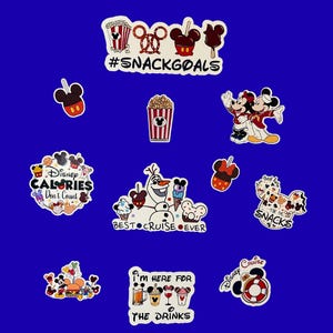 May include: A collection of colorful Disney-themed stickers on a blue background. The stickers feature various snacks, characters, and phrases like "#SNACKGOALS", "Disney Calories Don't Count", and "Best Cruise Ever".
