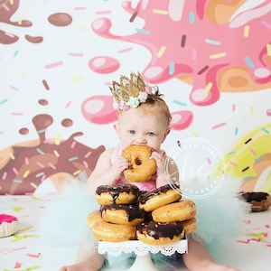 1 handmade Donut Grow Up birthday tutu on stretch elastic, 1 Donut Grow Up themed bodysuit, 1 single hair bow or flower on a stretch elastic headband.