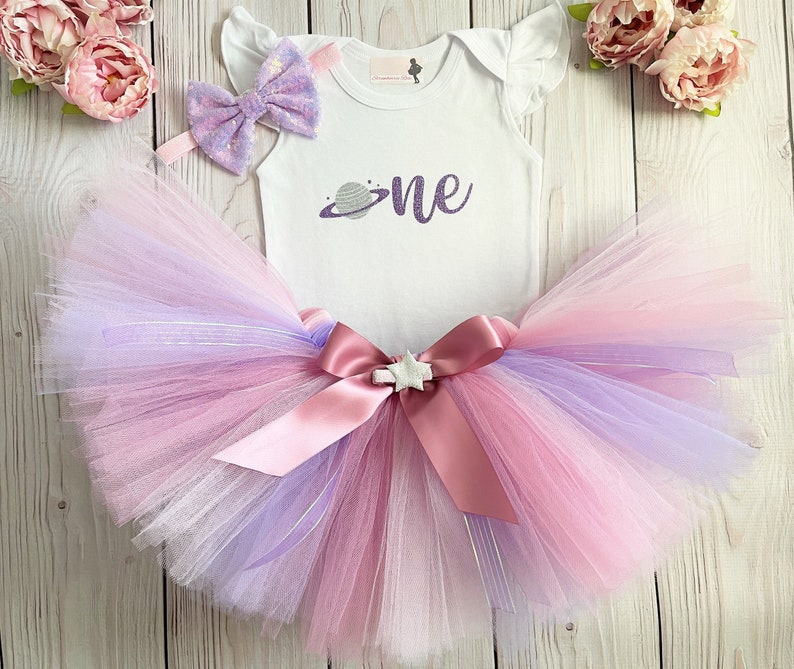 The perfect Space One Girly birthday outfit for your little princess! Can be made to match a birthday party theme! This listing includes choice of 1 handmade Tutu on stretch elastic, 1 bodysuit and 1 hair bow on a elastic headband.