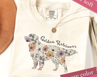 Camiseta con estampado floral de Golden Retriever y colores cómodos, regalo para mamás perrunas.