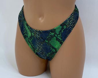 Braguita de bikini atrevida de pierna alta con estampado de serpiente