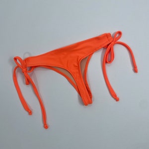Women’s neon orange Thong Bikini Bathing Suit Bottom