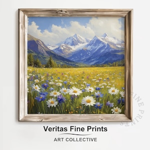 May include: A framed landscape painting depicts a vibrant meadow filled with white and blue wildflowers. Snow-capped mountains rise in the background under a blue sky. The artwork is signed "Veritas Fine Prints, ART COLLECTIVE."