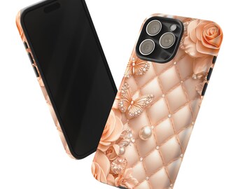 May include: A pink and gold phone case with a quilted pattern, pearl accents, and butterfly designs. The case has a cutout for the camera lens.