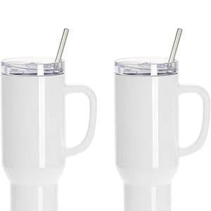 May include: Two white insulated travel mugs with handles and clear lids. Each mug has a silver-colored straw inserted. The mugs are designed to keep beverages hot or cold. Perfect for coffee, tea, or other drinks.