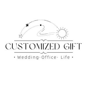 May include: A black and white logo featuring a stylized sun and star connected by a dotted arc line. Below the graphic, the text reads CUSTOMIZED GIFT in a serif font, followed by a horizontal line and the words Wedding, Office, Life.