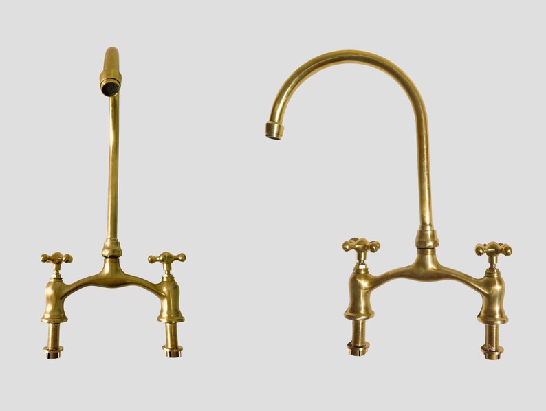 Two angles of handmade unlacquered brass bridge faucet with gooseneck spout.