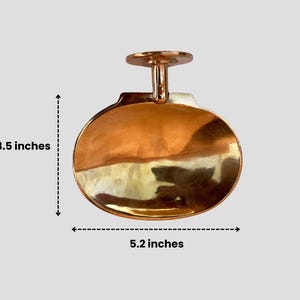 Brass wall mounted soap dish, 5.2 inches wide by 3.5 inches tall, vintage bathroom accessory.
