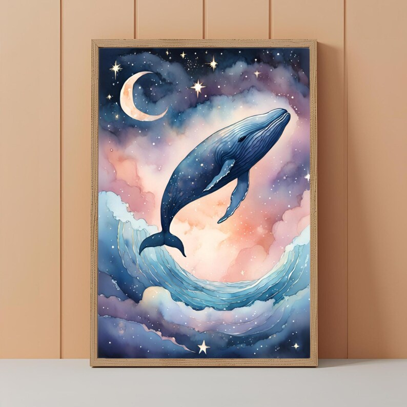 May include: Watercolor art print of a whale leaping from ocean waves toward a crescent moon and stars. The artwork features a blue whale against a backdrop of a starry night sky and pastel-colored clouds, framed in a light wood.
