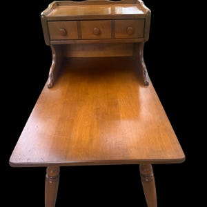 Vintage MCM Mid 20th Century Ethan Allen Baumritter Solid Tiered Wood End Accent Table With a Drawer.