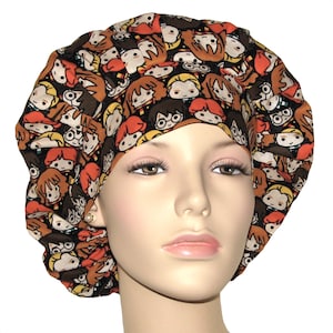 May include: A black scrub hat with a colorful print of cartoon characters from the Harry Potter series. The characters include Harry Potter, Ron Weasley, Hermione Granger, and others.