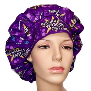 May include: Purple surgical scrub hat with a white starburst design and the text "Intubate Ventilate Caffeinate".