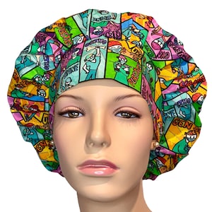 May include: A colorful surgical scrub hat with a comic book style design featuring medical specialties like "Neuro", "Spine", "Ortho", "Uro", and "Plastic".