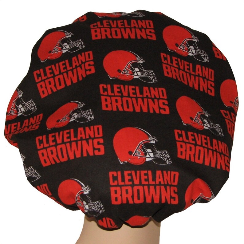 May include: Black shower cap with a repeating pattern of red Cleveland Browns logos and helmets.