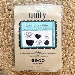 May include: A brown paper package with a blue and white label that says "To Me, You Are Perfect" and features a set of six pre-cut unmounted red rubber repositional stamps of flowers. The package also includes instructions for using the stamps and social media icons.
