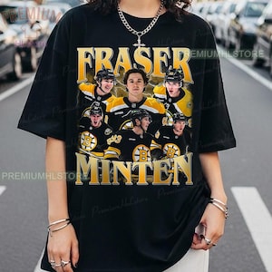 May include: Black t-shirt featuring a collage of hockey players in black and gold uniforms. The shirt has the names "FRASER" and "MINTEN" in gold lettering. The players are wearing helmets and hockey jerseys.