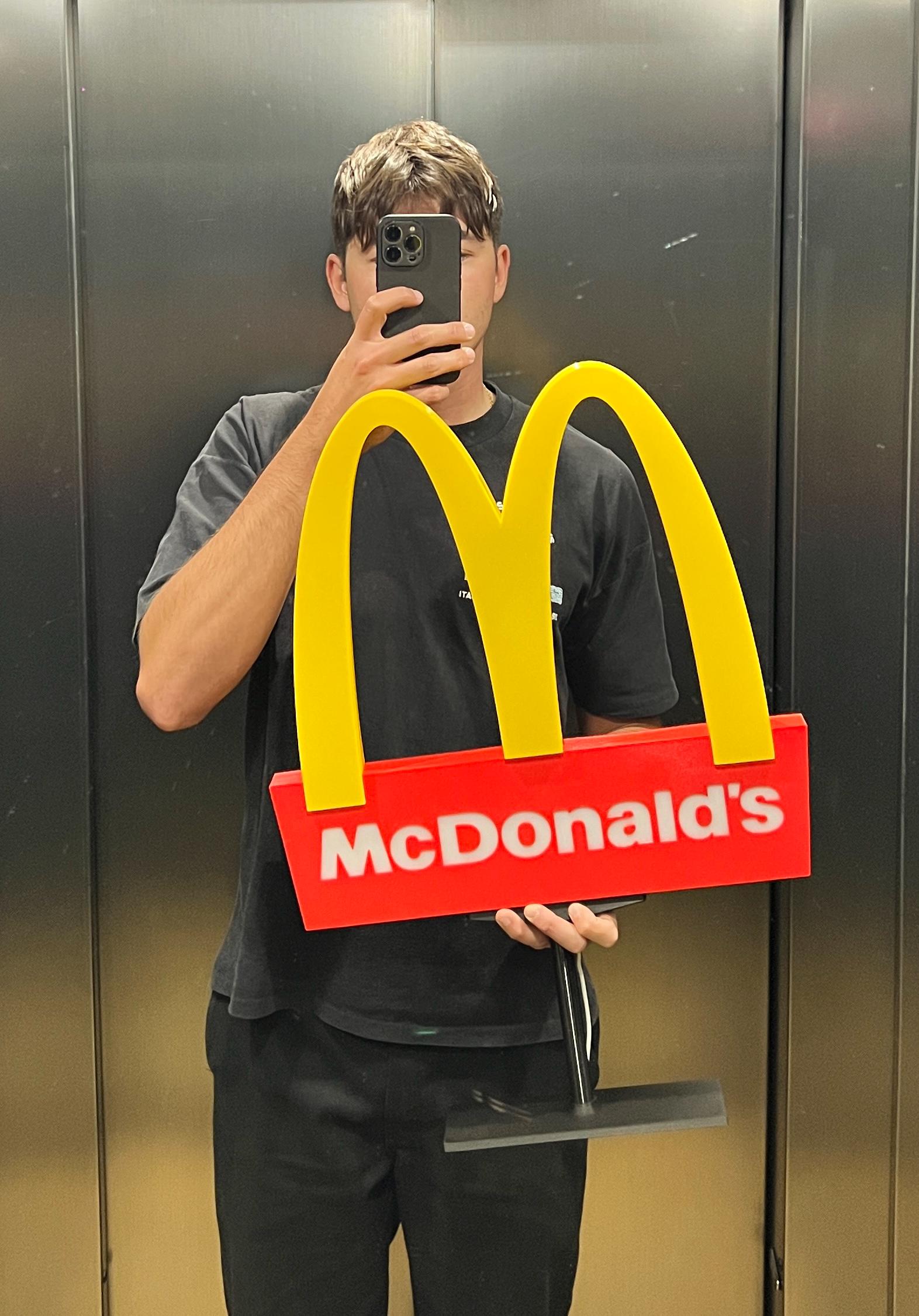 People Buying McDonald Fast Food Outside a Restaurant Building, in