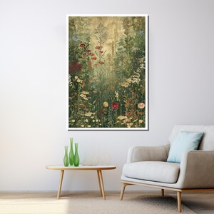 May include: A framed botanical print featuring a vibrant meadow scene. The artwork showcases a variety of wildflowers in shades of red, yellow, and white, set against a backdrop of green foliage and a golden-toned sky. The print is displayed on a white wall.