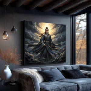 May include: A large framed canvas art print depicting a figure in flowing blue robes, set against a backdrop of dramatic clouds and a golden light. The artwork hangs above a gray sofa with decorative pillows, creating a serene and artistic ambiance.