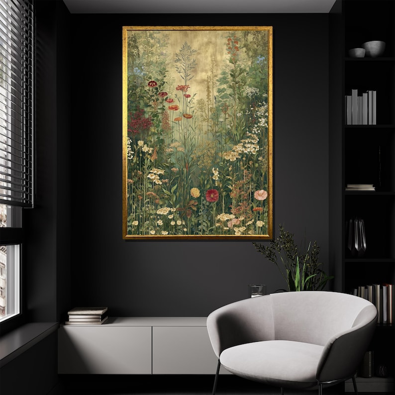May include: A framed floral print featuring a vibrant meadow scene. The artwork showcases a variety of wildflowers in shades of red, yellow, and white, set against a backdrop of green foliage and a golden-toned sky. The frame is a warm gold color.