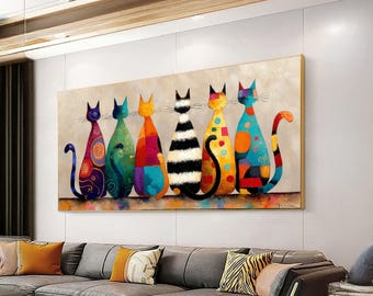 May include: A colorful abstract painting featuring six stylized cats in a row. Each cat has a unique pattern and color scheme, including blue, green, orange, black and white, and yellow. The artwork is framed and hangs above a gray sofa.