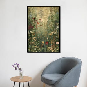 May include: A framed floral print featuring a vibrant meadow scene. The artwork showcases a variety of wildflowers in shades of red, yellow, and white, set against a backdrop of green foliage and a golden-toned sky. The print is encased in a black frame.