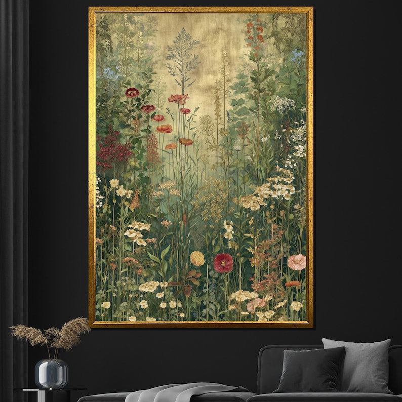 May include: A framed botanical print featuring a lush garden scene. The artwork showcases a variety of flowers in shades of red, pink, yellow, and white, set against a backdrop of green foliage and a golden background. The frame is a warm gold color.
