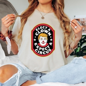Elect a Clown Expect a Circus Shirt – Funny Political Parody Tee, Anti Clown President Graphic Tee, Bold Statement Protest Unisex Gift Top