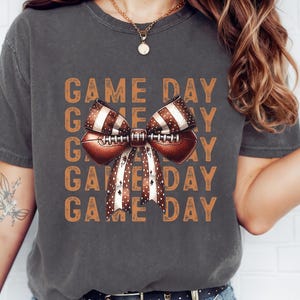 Comfort Colors® Game Day Football Bow Shirt, Cute Retro Fall T-Shirt for Women, Gameday Bow Graphic Tee, Vintage College Football Shirt