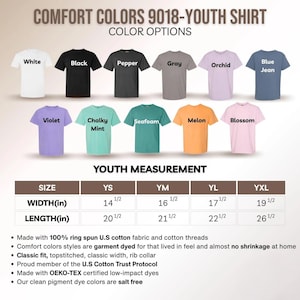 May include: A display of Comfort Colors youth shirts in various colors, including white, black, and blue jean. The image shows color options and youth measurements in inches, with width ranging from 14 1/2 to 19 1/2 inches and length from 20 1/2 to 26 1/2 inches.