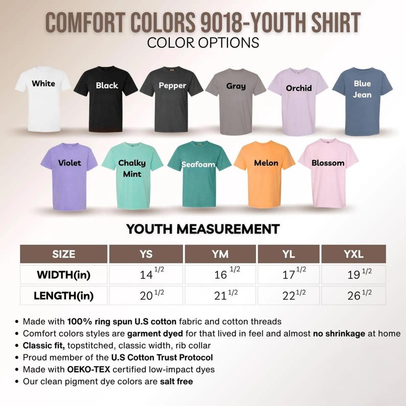 May include: A display of Comfort Colors youth shirts in various colors, including white, black, and blue jean. The image shows color options and youth measurements in inches, with width ranging from 14 1/2 to 19 1/2 inches and length from 20 1/2 to 26 1/2 inches.