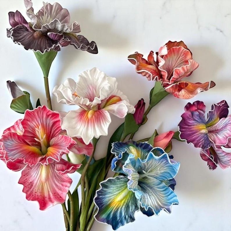 May include: A bouquet of six artificial silk iris flowers in various colors, including purple, pink, white, blue, and orange. The flowers have ruffled petals and are arranged in a vase.