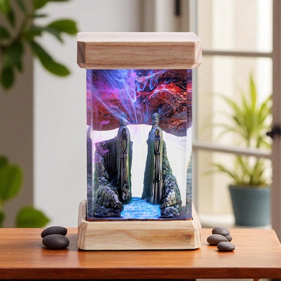 A fantasy stone guardian scene encased in glowing resin — part lamp, part miniature diorama you'd expect to find in a concept art studio.