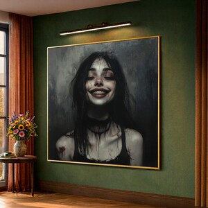 May include: A framed portrait of a woman with long black hair and a wide, unsettling smile. The artwork features a dark colour palette with a gold frame, and is mounted on a green wall. The woman is wearing a black top and choker.