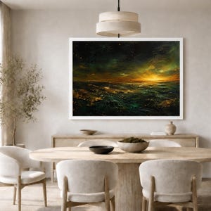 May include: A rectangular landscape painting in a white frame featuring a dark, textured ocean scene at sunset. The artwork displays deep green and black waves with golden light reflecting on the horizon under a dark, moody, and cloudy sky.