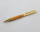 Gentry twist pen made with Yellow cedar burl and resin