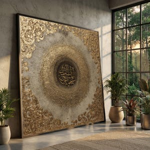 May include: A large square wall art piece featuring a central circular medallion with black Arabic calligraphy surrounded by a textured gold leaf sunburst pattern. The corners are adorned with ornate gold relief scrollwork on a beige background.