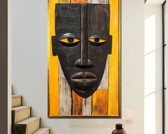 May include: A wooden mask with a black face and yellow eyes, painted on a background of yellow and orange stripes.