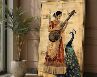 May include: A framed artwork depicts a woman in traditional Indian attire playing a stringed instrument. A peacock stands beside her. The woman wears a red and cream sari. The artwork has a vintage aesthetic with a gold frame.