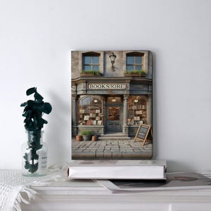May include: A decorative notebook featuring a detailed illustration of a vintage bookstore. The image shows the bookstore's facade with the word "BOOKSTORE" above the entrance. The building has arched windows, a cobblestone path, and a small chalkboard sign.