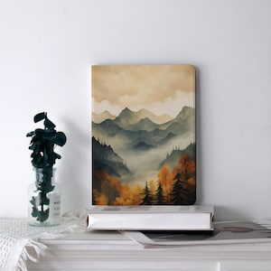 May include: A rectangular art print featuring a watercolor landscape of mountains and trees in shades of green, orange, and brown. The artwork depicts a misty valley scene with a warm, neutral sky.