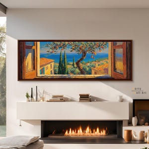 Può includere: Un dipinto paesaggistico panoramico in una cornice marrone scuro che mostra una vista attraverso una finestra aperta. La scena presenta un albero di arance in primo piano, edifici con tetti in terracotta, alti cipressi e un mare blu.