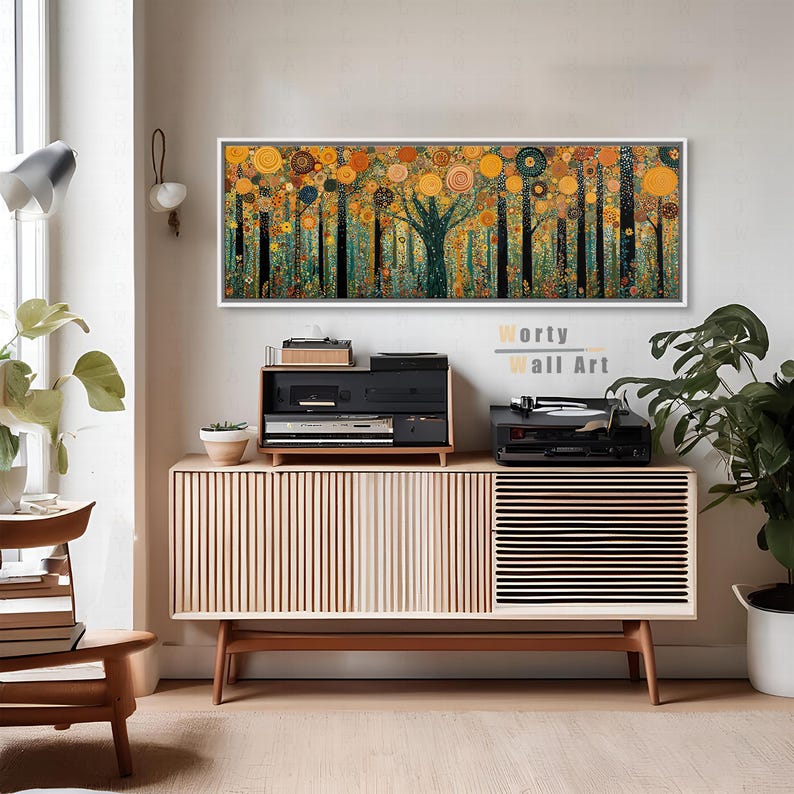 May include: A rectangular wall art print featuring a stylized forest scene with dark vertical tree trunks and a canopy of circular orange, yellow, and teal patterns. The artwork is framed in white and displays the text Worty Wall Art in the center.