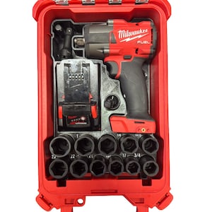 May include: A red Milwaukee FUEL impact wrench kit in a red hard case. The kit includes the impact wrench, battery, charger, and a set of black sockets. The case has a clear top and a handle for easy transport.