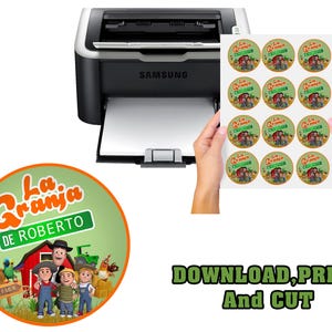 May include: A sheet of circular stickers with a farm theme, featuring the text "La Granja de Roberto", is held near a printer. The stickers have a green background and show cartoon characters, a red barn, and a tractor. The text "DOWNLOAD, PRINT And CUT" is also visible.