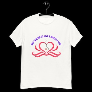 May include: White t-shirt with a pink heart design and the text "BMP Testing to Save a Mommy's Life" in purple.