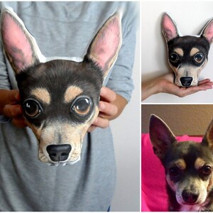 May include: A custom-made pillow featuring a realistic portrait of a chihuahua dog. The pillow is made of soft fabric and has a brown and black color scheme. The dog's eyes are large and brown, and its ears are perky.