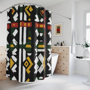 May include: A black shower curtain featuring a geometric pattern in white, yellow, red, and green. The design is inspired by African art.
