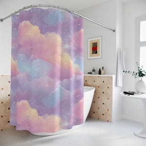 May include: A pastel-colored shower curtain with a dreamy cloud and star design. The curtain features shades of purple, pink, yellow, and blue, creating a soft, whimsical aesthetic. The design includes sparkling stars and crescent moons.