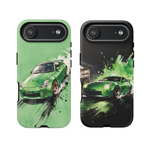 May include: Two smartphone cases featuring a green sports car in a watercolor style. The left case has a light green background, while the right case has a black background with green paint splatters and a garage setting in the background.